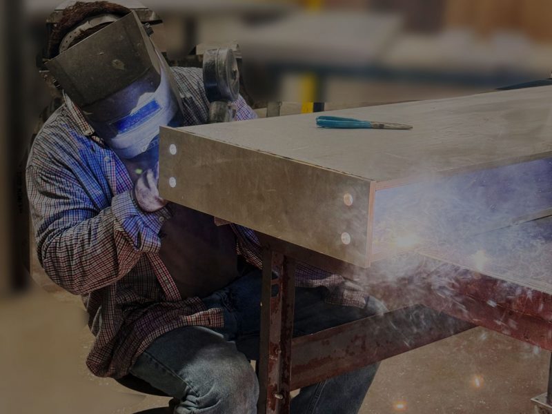 Welder working on a channel letter