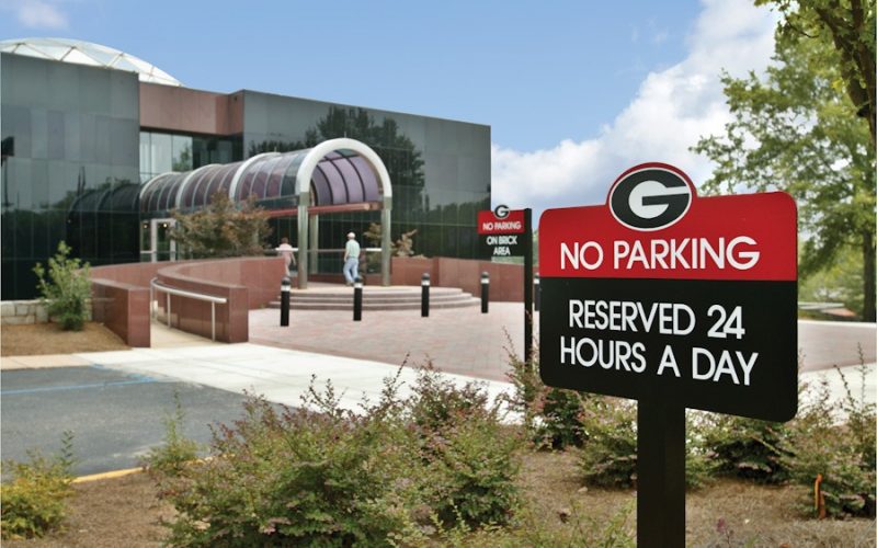 No Parking - Reserved 24 hours a day sign, a series 200 sign